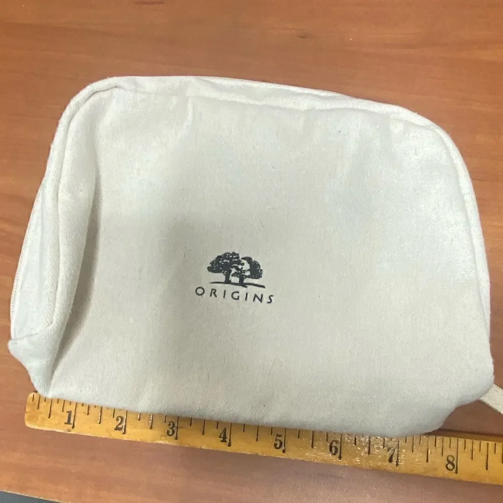 Origins cream canvas make up bag with zip closure small marks inside
